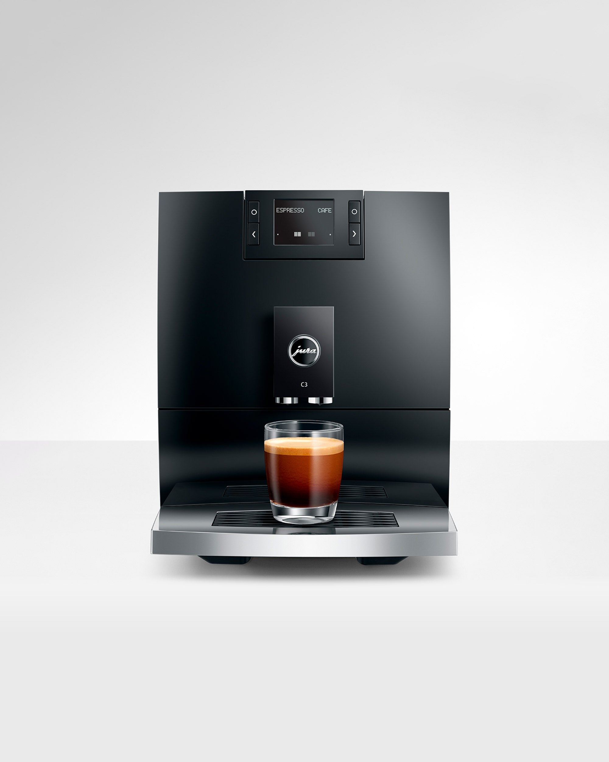 JURA C3 Piano Black en gros plan avec café